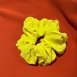 A Bronze Age L silk scrunchie in highlighter yellow